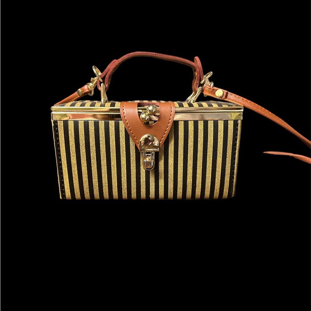 Little lock box crossbody bag with a mirror in it